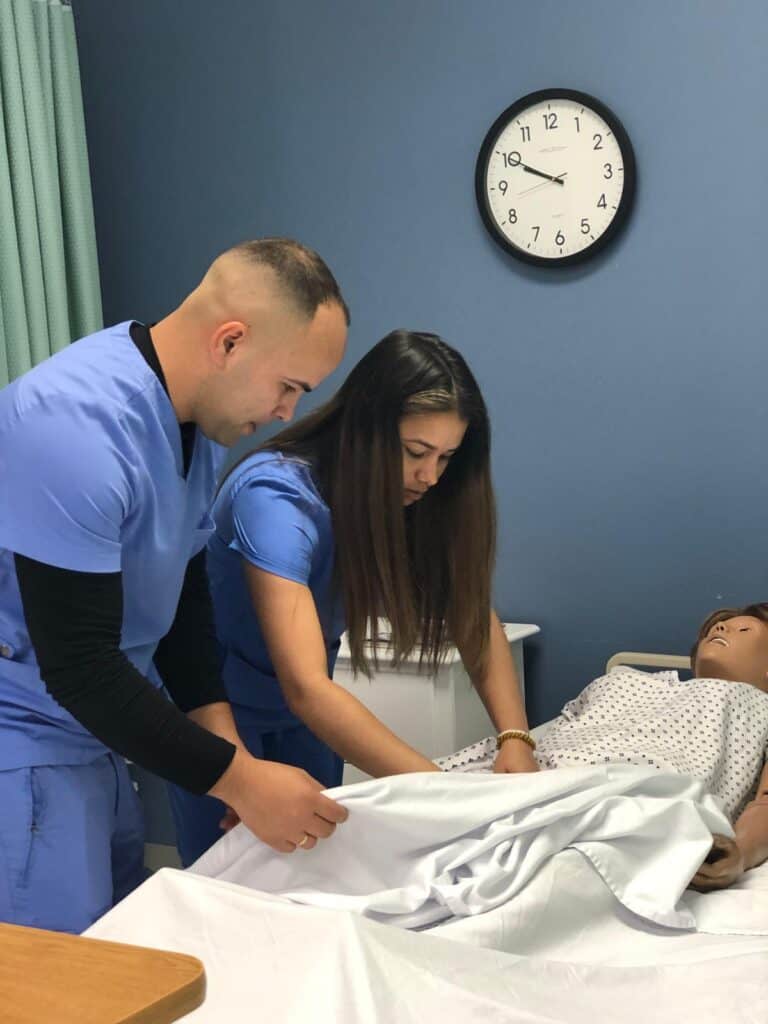 FVI Miramar nursing assistant school - home health aide school students participate in a a nursing assistant lab
