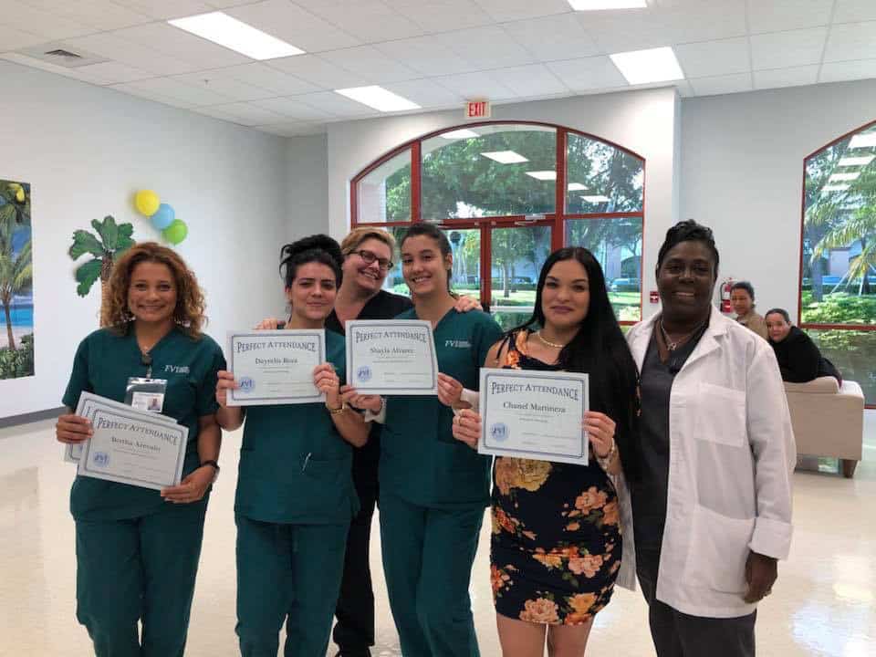 group of students receiving a perfect attendance award