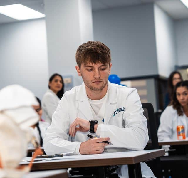 Miami nursing school student studies and prepares for the NCLEX in an FVI classroom